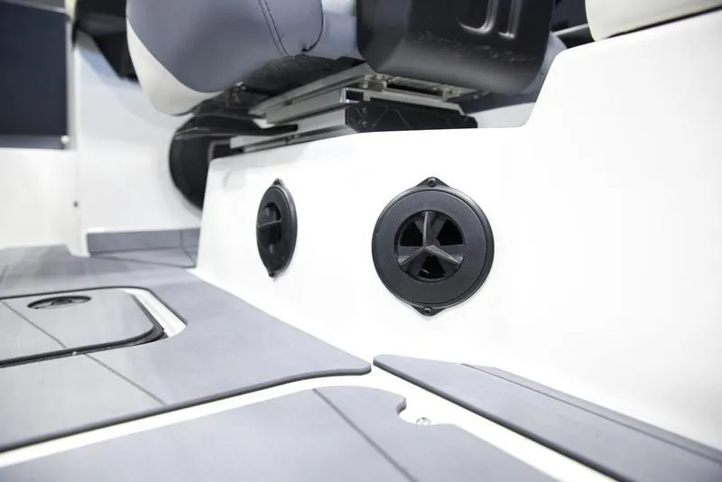 Slide: The Image of 2025 Axis A245 boat interior with sleek seating and built-in speakers. - 14
