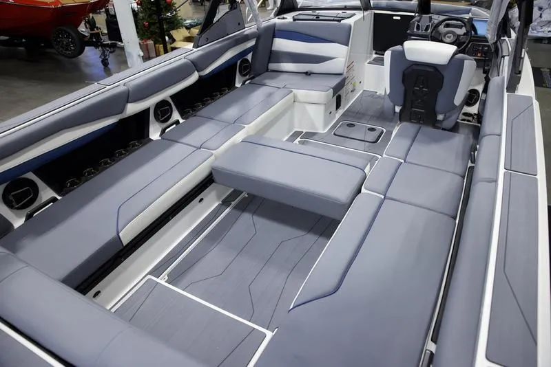 Slide: The Image of 2025 Axis A245 boat interior with spacious gray seating and modern design. - 17