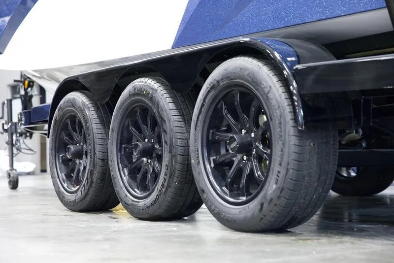 Slide: The Image of Triple axle trailer with black wheels for 2025 Axis A245 boat. - 6