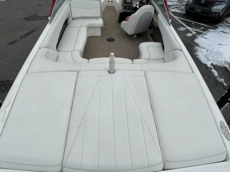 Slide: The Image of 2001 MasterCraft X30 boat interior with white seating and steering wheel. - 10