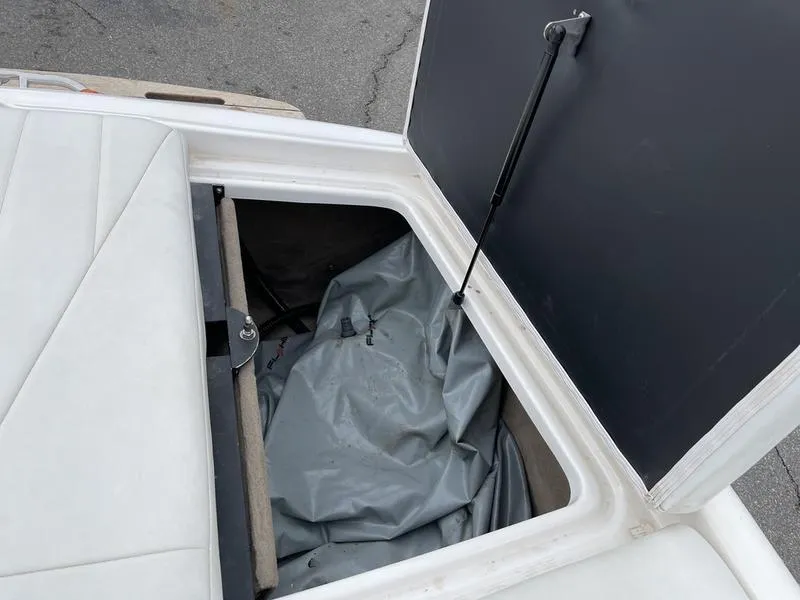 Slide: The Image of Open storage compartment in 2001 MasterCraft X30 boat. - 12