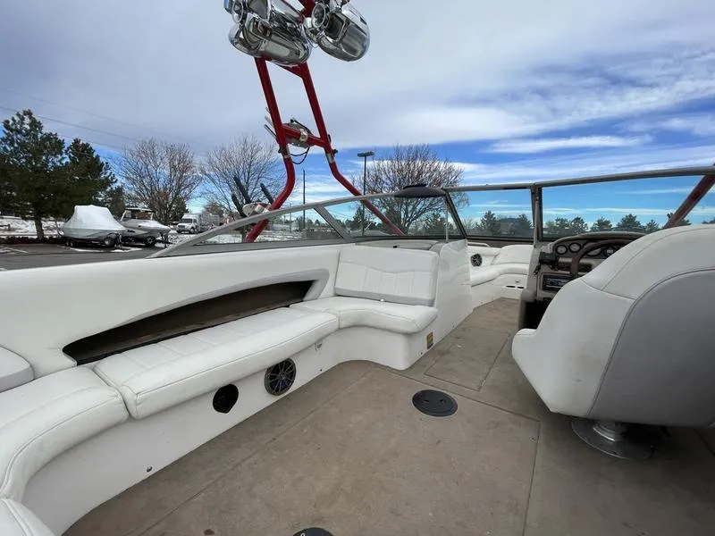 Slide: The Image of 2001 MasterCraft X30 boat interior with white seating and red wakeboard tower. - 13
