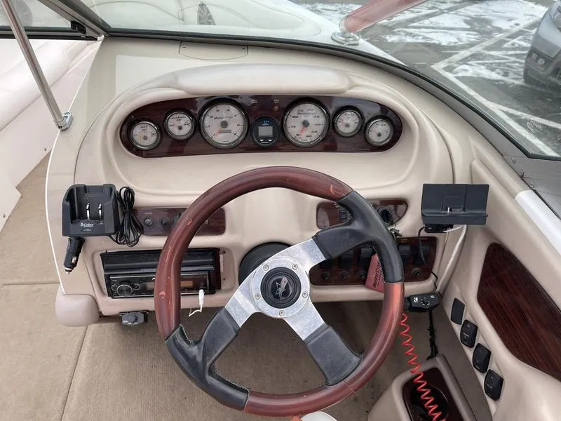 Slide: The Image of 2001 MasterCraft X30 boat dashboard with gauges and steering wheel. - 16