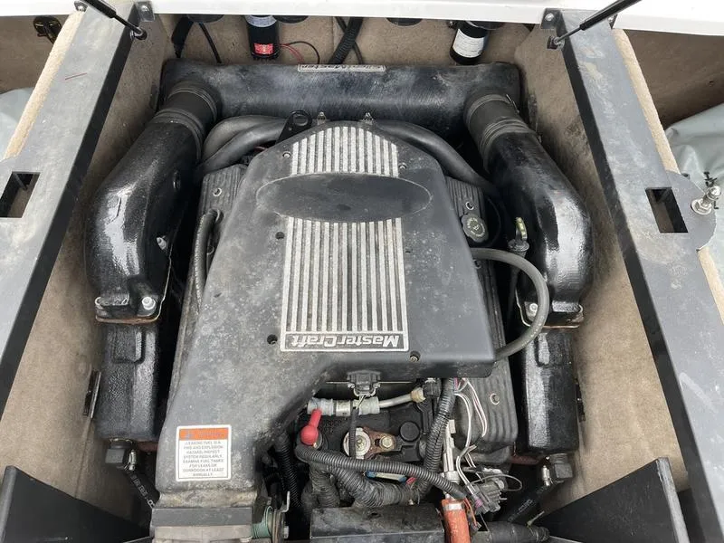 Slide: The Image of 2001 MasterCraft X30 engine compartment with visible components and wiring. - 19