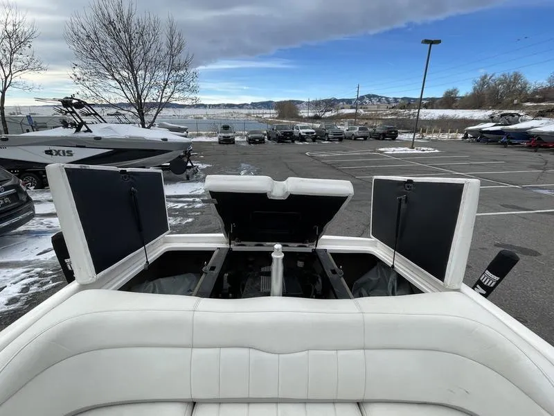 Slide: The Image of 2001 MasterCraft X30 boat with open engine compartment in a snowy parking lot. - 20