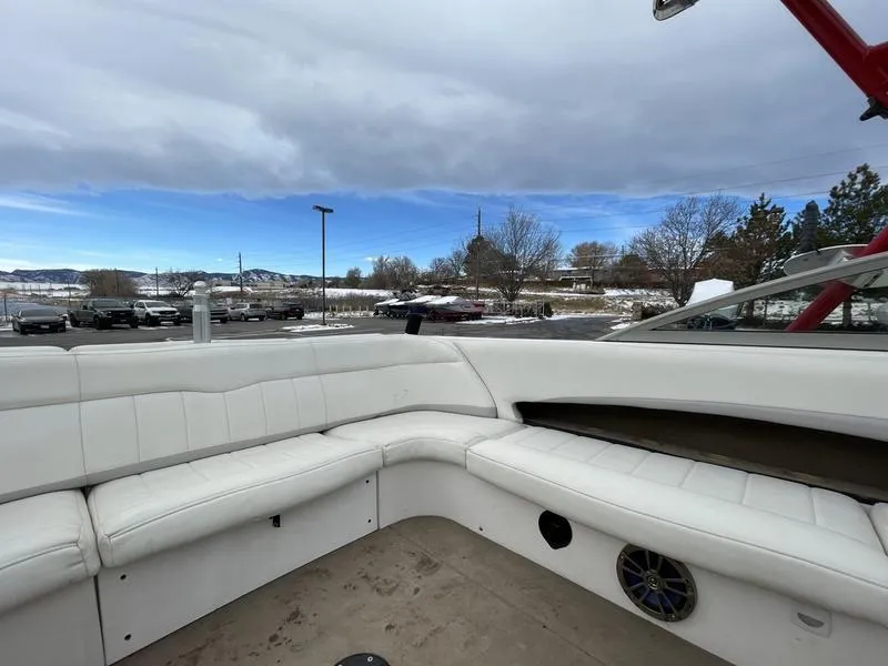 Slide: The Image of 2001 MasterCraft X30 boat interior with white seating and outdoor view. - 25