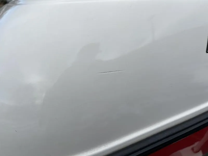 Slide: The Image of Close-up of a scratch on a 2001 MasterCraft X30 boat surface. - 28