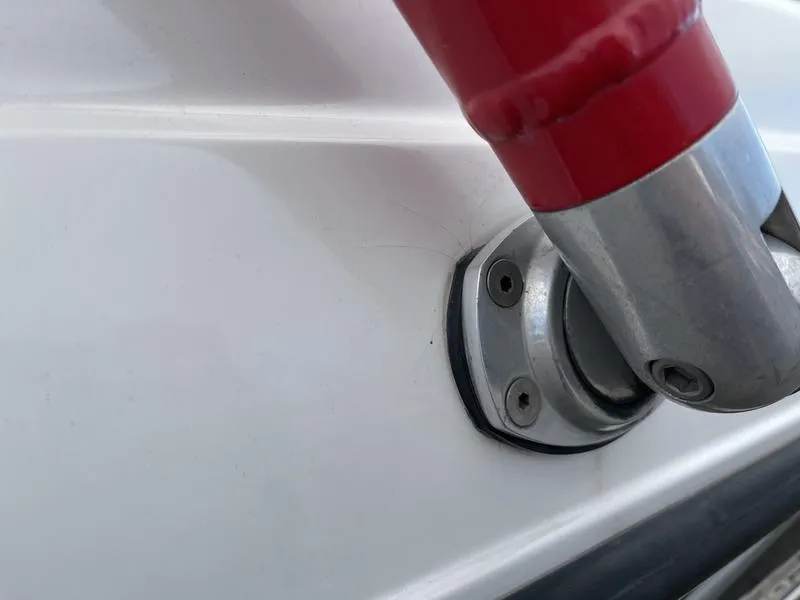 Slide: The Image of Close-up of a 2001 MasterCraft X30 boat fitting with red handle. - 30