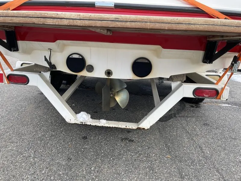 Slide: The Image of Rear view of 2001 MasterCraft X30 boat on trailer, showing propeller and hull. - 34