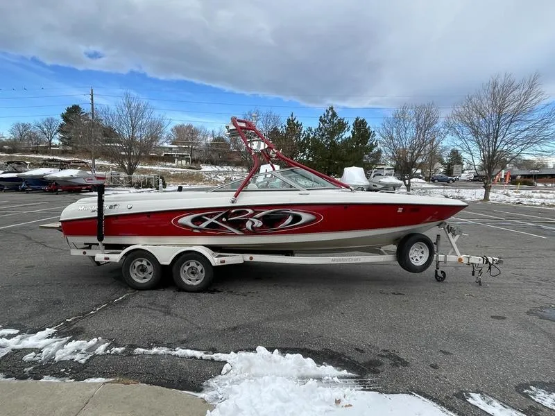 Slide: The Image of 2001 MasterCraft X30 boat on trailer in snowy parking lot. - 6