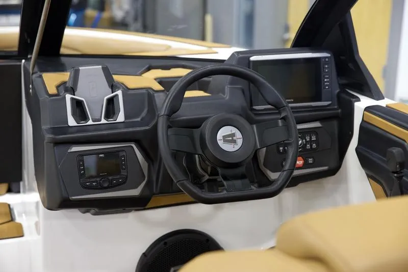 Slide: The Image of 2025 Axis T235 boat dashboard with steering wheel and digital displays. - 12