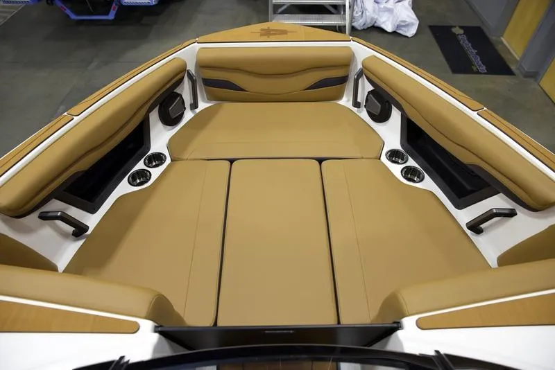 Slide: The Image of 2025 Axis T235 boat interior with tan seating and cup holders. - 15