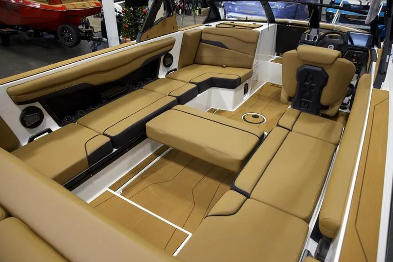 Slide: The Image of Luxurious interior of 2025 Axis T235 boat with tan seating and modern design. - 17