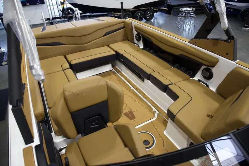 Slide: The Image of Luxurious interior of 2025 Axis T235 boat with tan seating and modern design. - 18