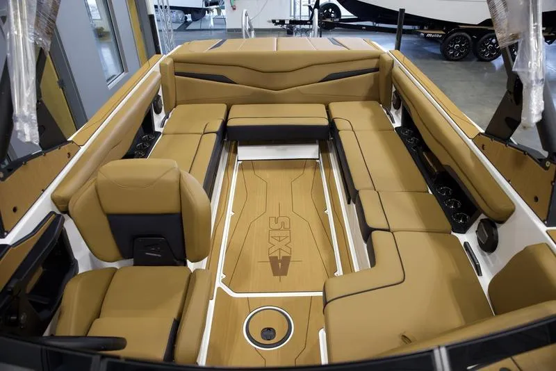Slide: The Image of Luxurious interior of 2025 Axis T235 boat with tan seating and sleek design. - 19