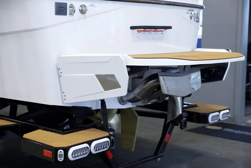 Slide: The Image of Axis T235 2025 boat rear view with swim platform and trailer lights. - 5