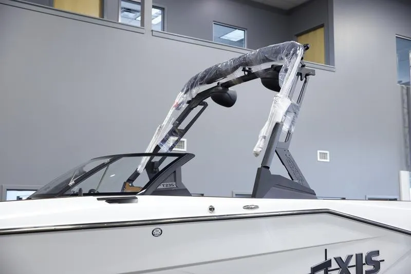 Slide: The Image of 2025 Axis T235 boat with wrapped tower in showroom. - 7