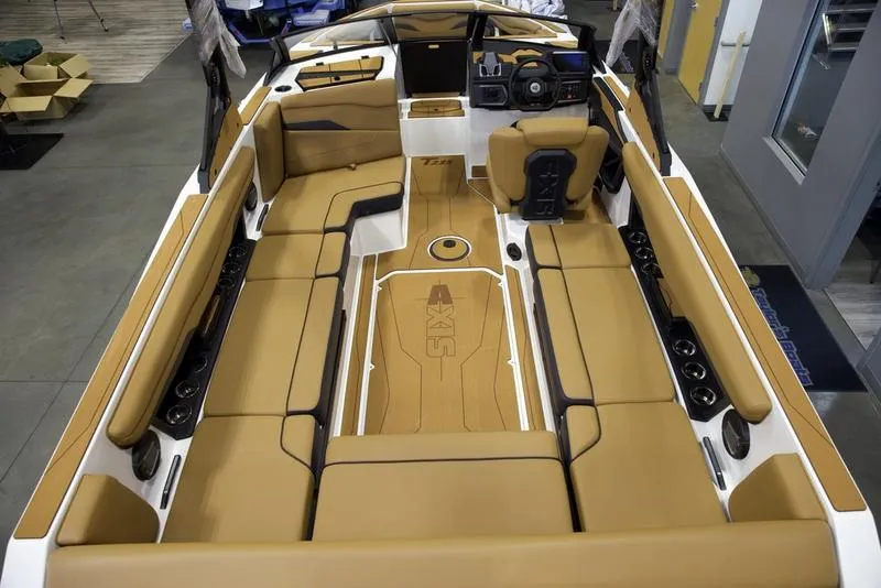 Slide: The Image of Luxurious interior of 2025 Axis T235 boat with tan seating and modern dashboard. - 9