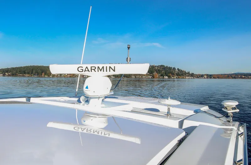 Slide: The Image of 2025 Cruisers Yachts 46 Cantius with Garmin radar on calm water. - 11