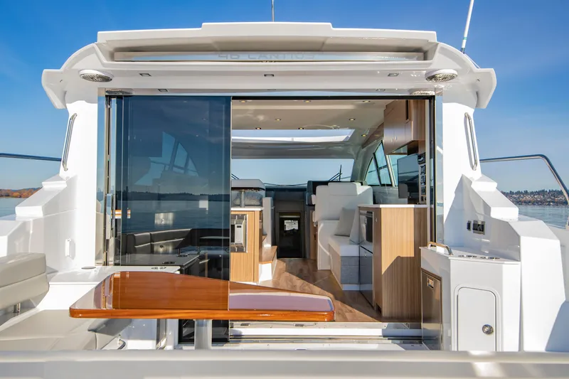 Slide: The Image of Luxurious 2025 Cruisers Yachts 46 Cantius interior with modern design and open deck view. - 15