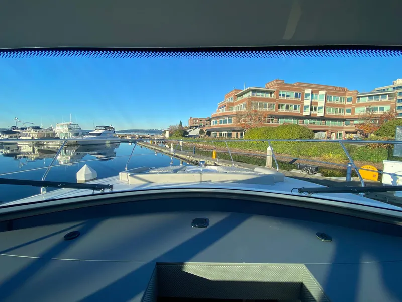 Slide: The Image of View from 2025 Cruisers Yachts 46 Cantius, overlooking marina and waterfront buildings. - 36