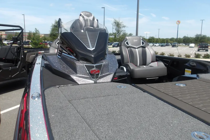 Slide: The Image of 2025 Ranger Z520R Cup-Equipped boat with sleek design and comfortable seating in a parking lot. - 11