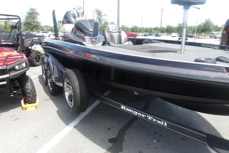 Slide: The Image of 2025 Ranger Z520R Cup-Equipped boat on trailer in parking lot. - 2