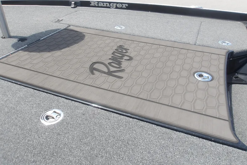 Slide: The Image of 2025 Ranger Z520R Cup-Equipped boat deck with textured surface and logo. - 7
