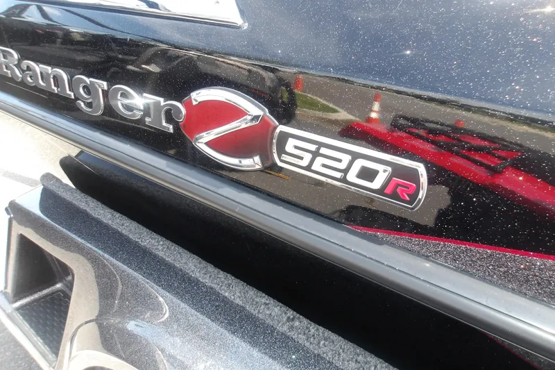 Slide: The Image of 2025 Ranger Z520R Cup-Equipped boat emblem on a sparkling black surface. - 13