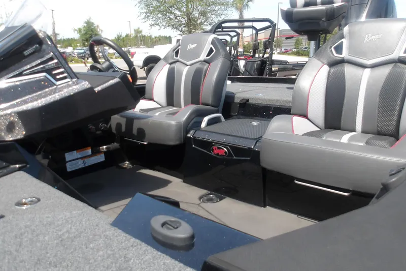 Slide: The Image of 2025 Ranger Z520R Cup-Equipped boat interior with sleek seating and modern dashboard design. - 21