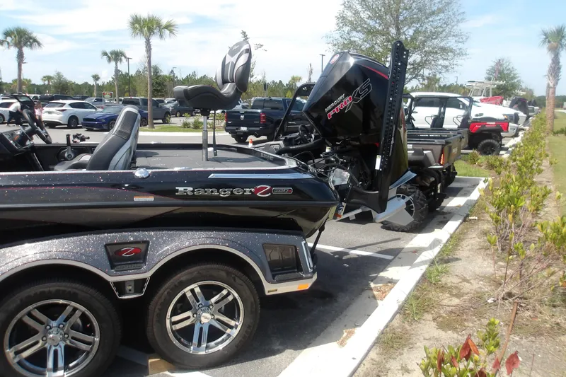 Slide: The Image of 2025 Ranger Z520R Cup-Equipped boat with Mercury Pro XS engine in parking lot. - 3