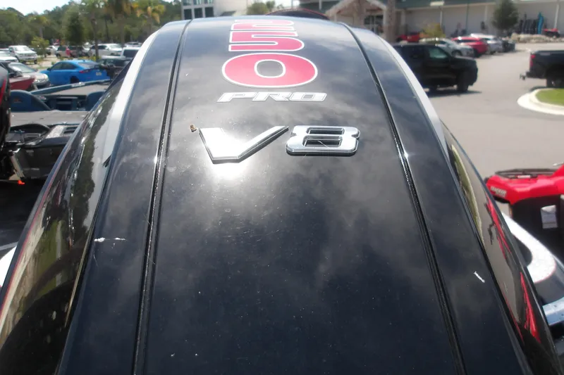 Slide: The Image of 2025 Ranger Z520R Cup-Equipped V8 engine detail in a parking lot. - 16