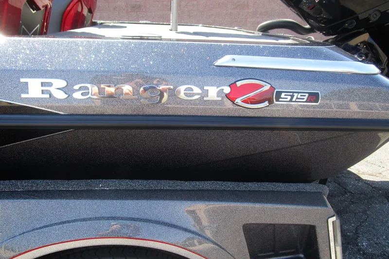 Slide: The Image of 2025 Ranger Z519R Cup-Equipped boat, metallic finish, close-up of logo and model name. - 1