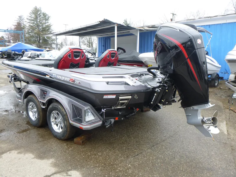 Slide: The Image of 2025 Ranger Z519R Cup-Equipped boat with powerful outboard motor, parked on a trailer. - 3