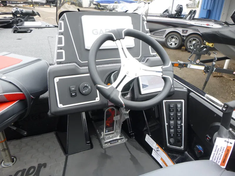 Slide: The Image of 2025 Ranger Z519R Cup-Equipped boat dashboard with steering wheel and control panel. - 7