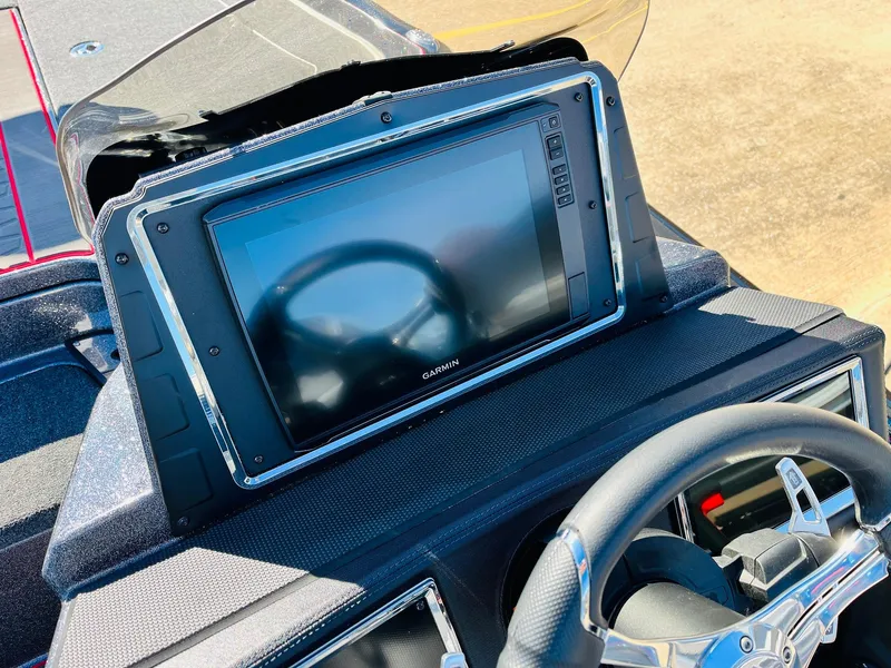 Slide: The Image of 2025 Ranger Z520R Cup-Equipped boat dashboard with Garmin display and steering wheel. - 32