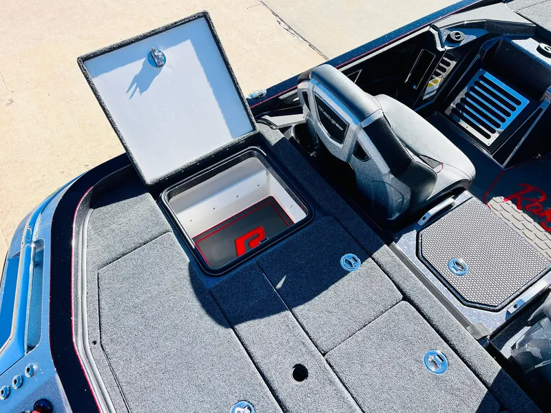 Slide: The Image of 2025 Ranger Z520R Cup-Equipped boat interior with open storage compartment. - 42