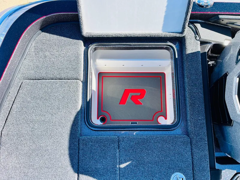 Slide: The Image of 2025 Ranger Z520R Cup-Equipped boat storage compartment with red "R" logo. - 43