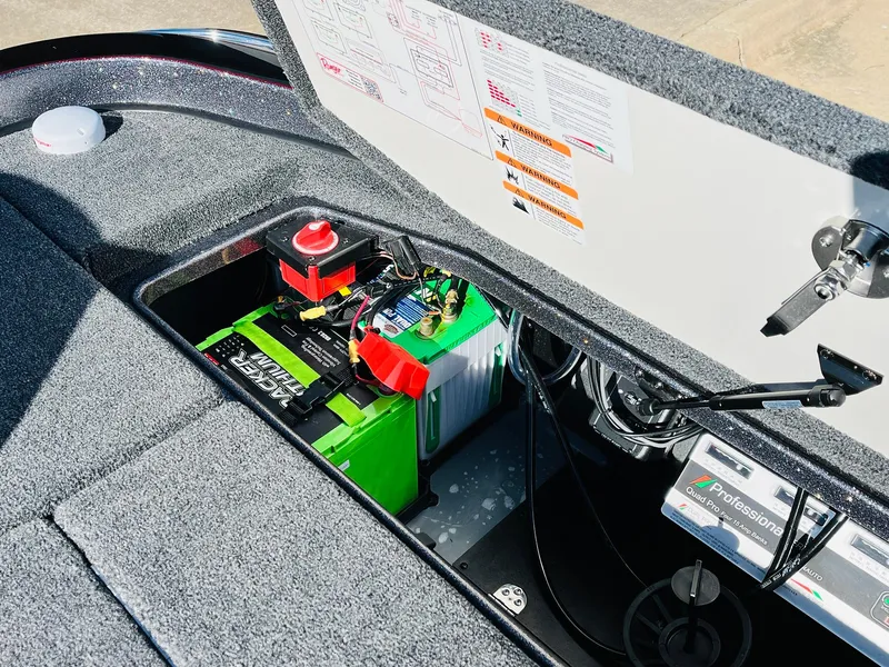 Slide: The Image of 2025 Ranger Z520R Cup-Equipped boat battery compartment with wiring and safety instructions. - 49