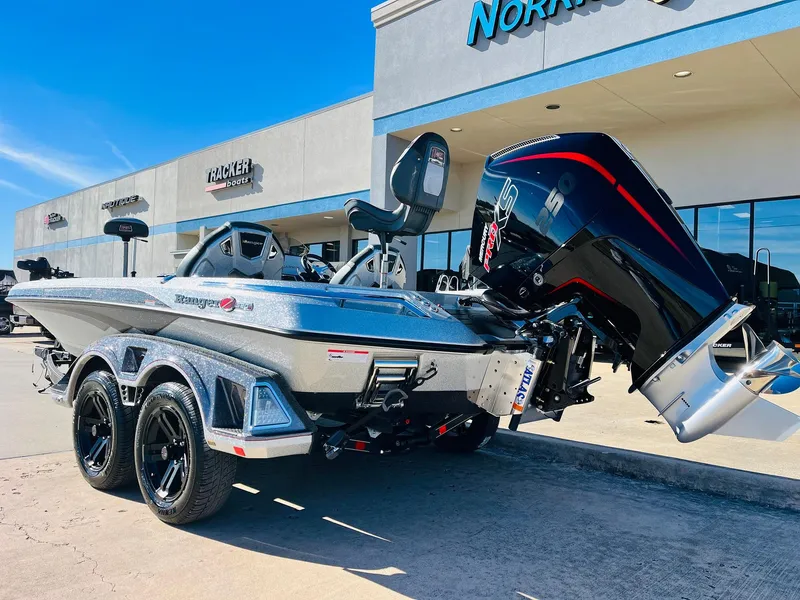 Slide: The Image of 2025 Ranger Z520R Cup-Equipped boat with powerful outboard motor in dealership lot. - 6