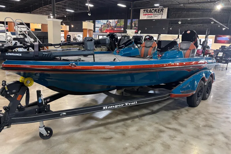 The Image of 2025 Ranger Z519R Cup-Equipped boat displayed indoors on a trailer. - 90