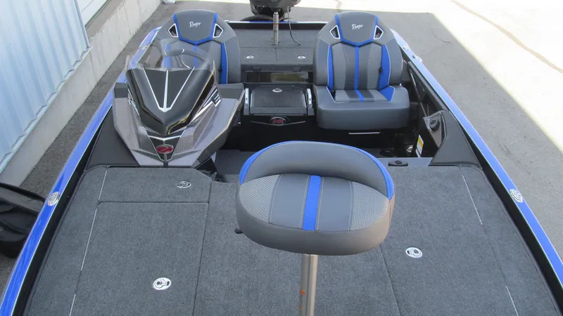 Slide: The Image of 2025 Ranger Z520R Cup-Equipped boat interior with blue and gray seating. - 11