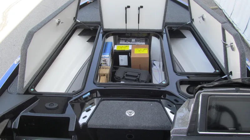 Slide: The Image of 2025 Ranger Z520R Cup-Equipped boat storage compartments open, showcasing ample space and organization. - 8