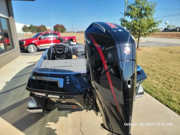 Slide: The Image of 2025 Ranger Z519R Cup-Equipped boat with powerful engine, parked outdoors. - 2