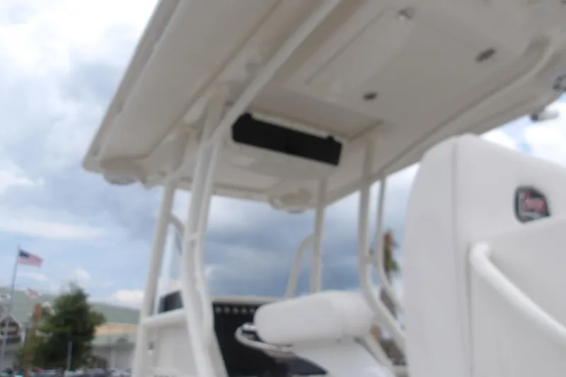 Slide: The Image of Blurry view of a 2025 Ranger 2600 Bay boat's interior under cloudy skies. - 12