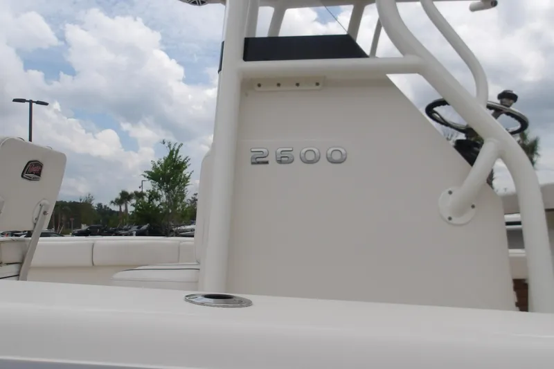 Slide: The Image of 2025 Ranger 2600 Bay boat interior with steering wheel and seating. - 14