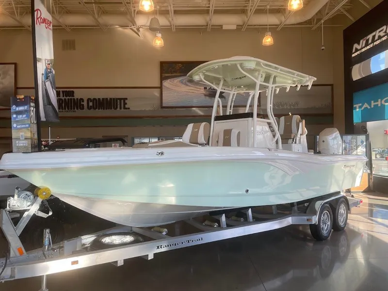 The Image of 2025 Ranger 2600 Bay boat displayed in showroom on trailer. - 0