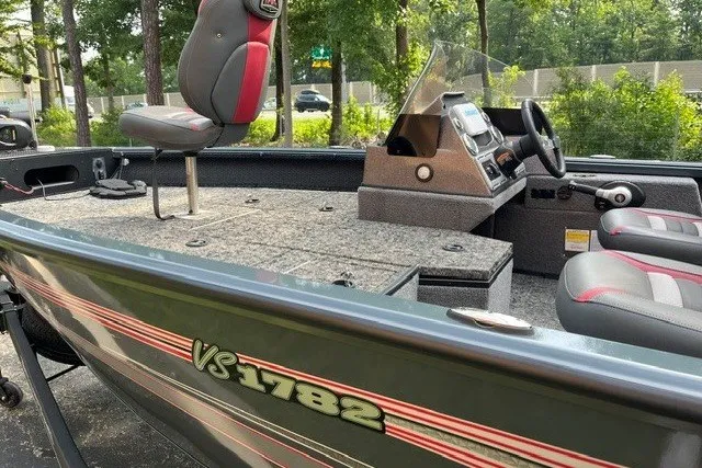 Slide: The Image of 2025 Ranger VS1782SC Angler boat with seating and control console, parked outdoors. - 5