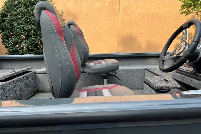 Slide: The Image of 2025 Ranger VS1782SC Angler boat interior with gray and red seating, steering wheel visible. - 9