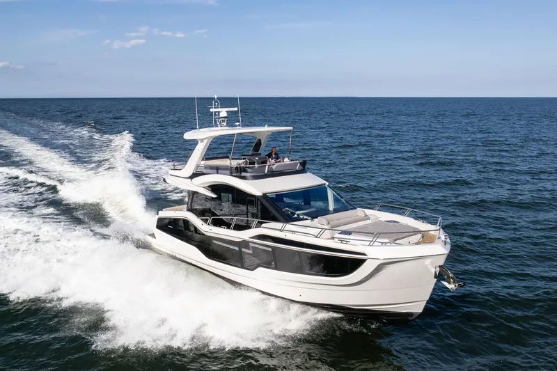 The Image of 2025 Galeon 560 Fly yacht cruising on open sea. - 0